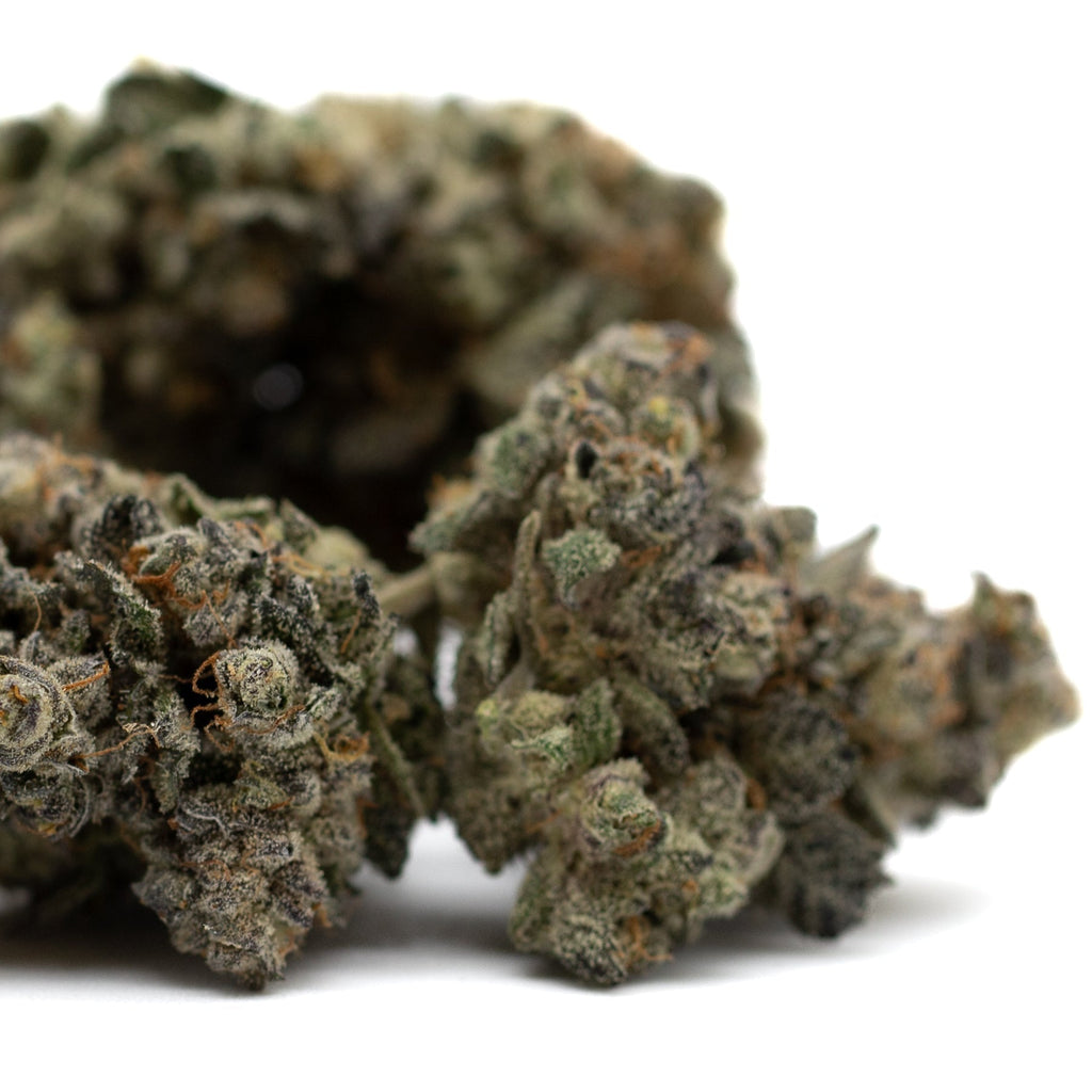 Dense cannabis buds of Butter OG Indoor THCa Flower showcasing premium hemp flower quality