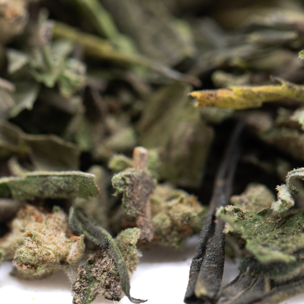 Subzero Greenhouse THCa trim with green marijuana buds and white trichomes for pain management